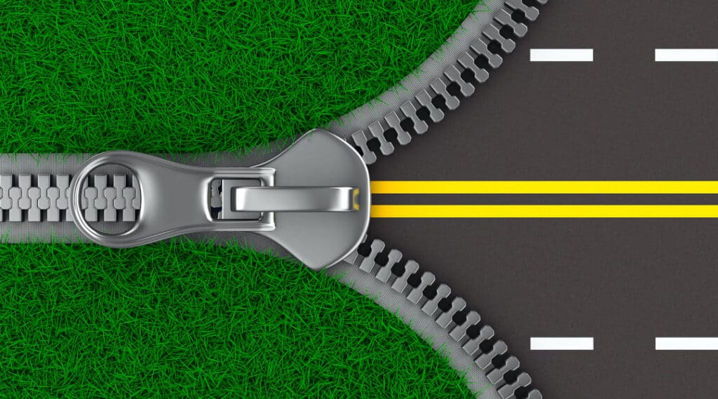 Illustration des Reissverschlussverkehrs: zwei Fahrspuren fliessen wie ein Reissverschluss zu einer Spur zusammen
